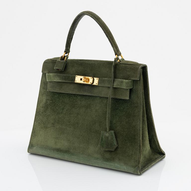 Hermès, a 1960's green suede 'Kelly 30'.