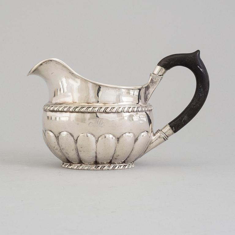 A RUSSIAN SILVER CREAM JUG, maker's mark Erik Frisk, St petersburg, 1825.