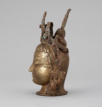 A bronze head of Buddha, probably Nepal.