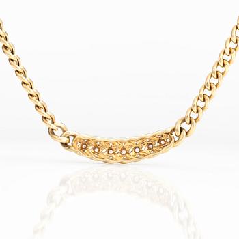 A 14K gold necklace with diamonds ca 0.035 ct in total.