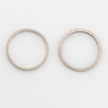 Two  platinum rings, one with eight cut diamonds.