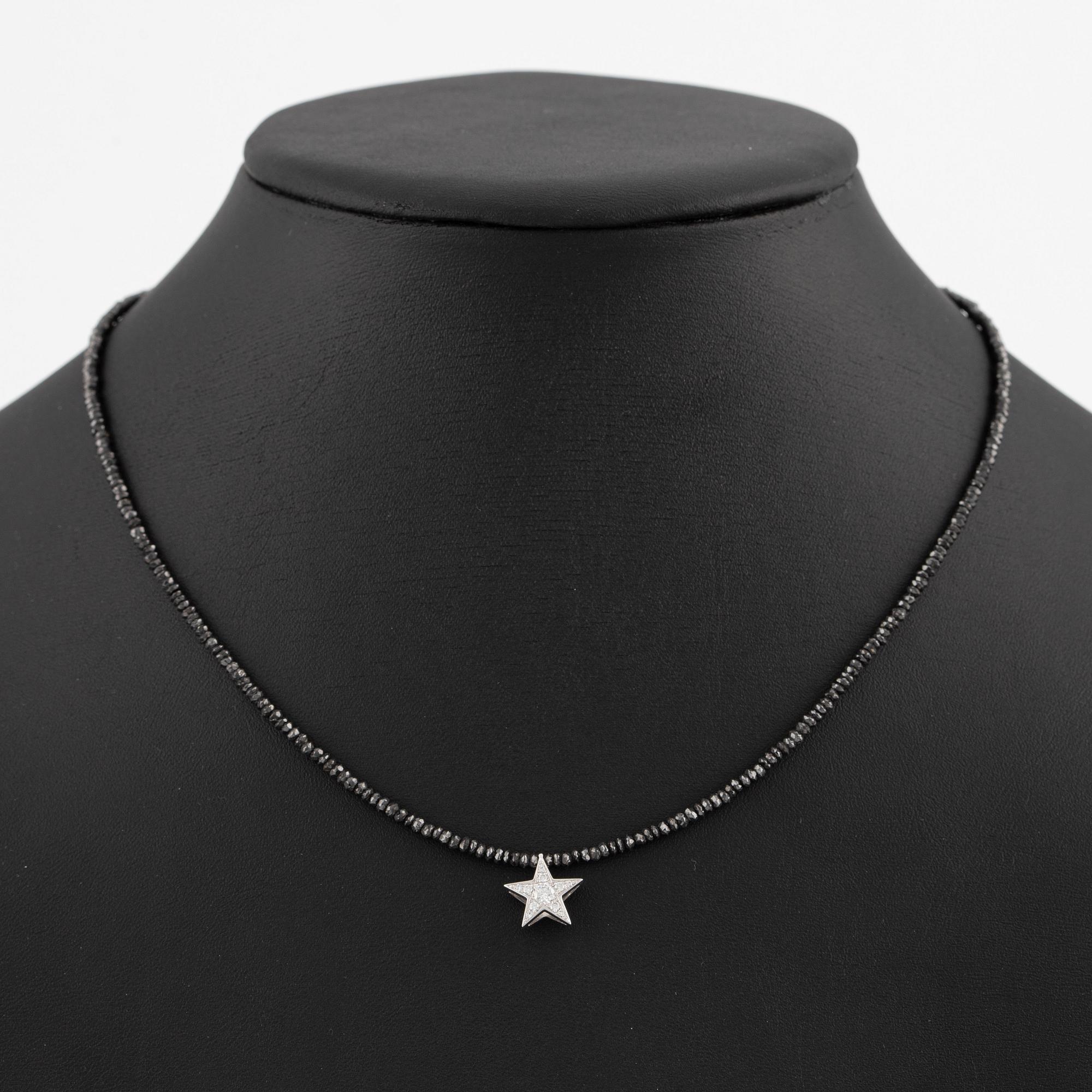 Necklace, Atelier Ajour, black diamonds with a star pendant set with brilliant-cut diamonds.