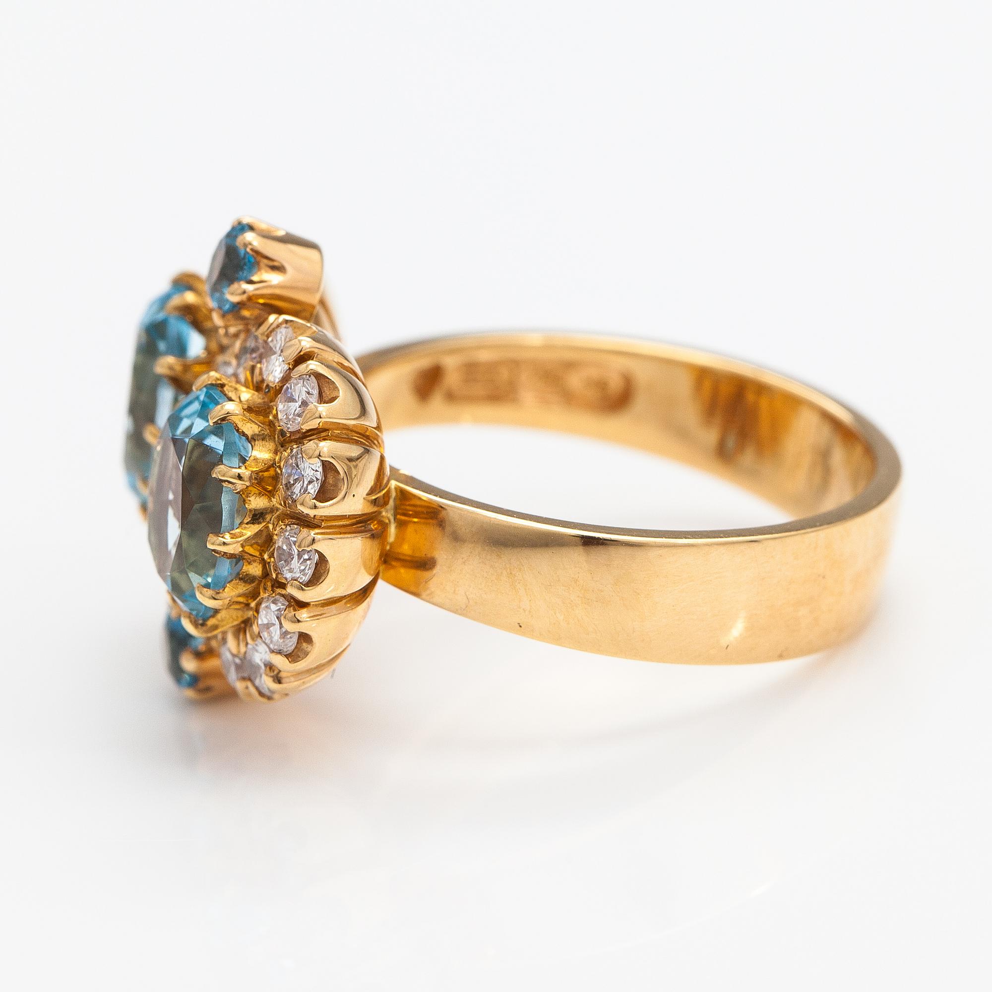 An 18K gold ring "Sophia Albertina" with topazes and diamonds ca. 0.72 ct in total. Ofelia Jewelry, Helsinki 1998.