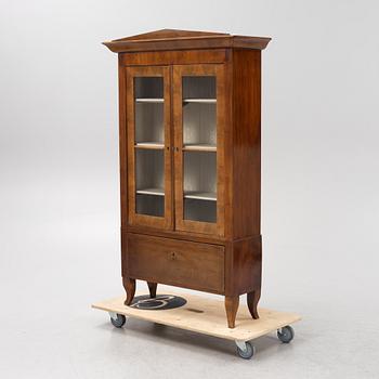 A mahogany veneered book cabinet. 19th Century.