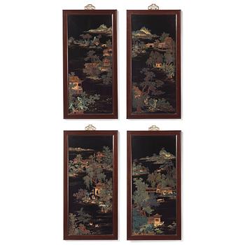 A set of four Chinese lacquer panels with wooden frames, early 20th century.