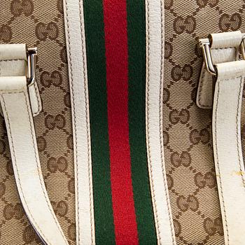 A Gucci canvas and leather hand bag.