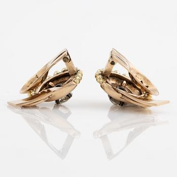A pair of earrings in 14K gold set with old-cut diamonds.