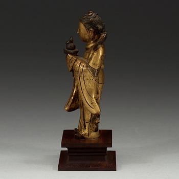 A gilt bronze figure of Longnü, Ming Dynasty, 17th century.