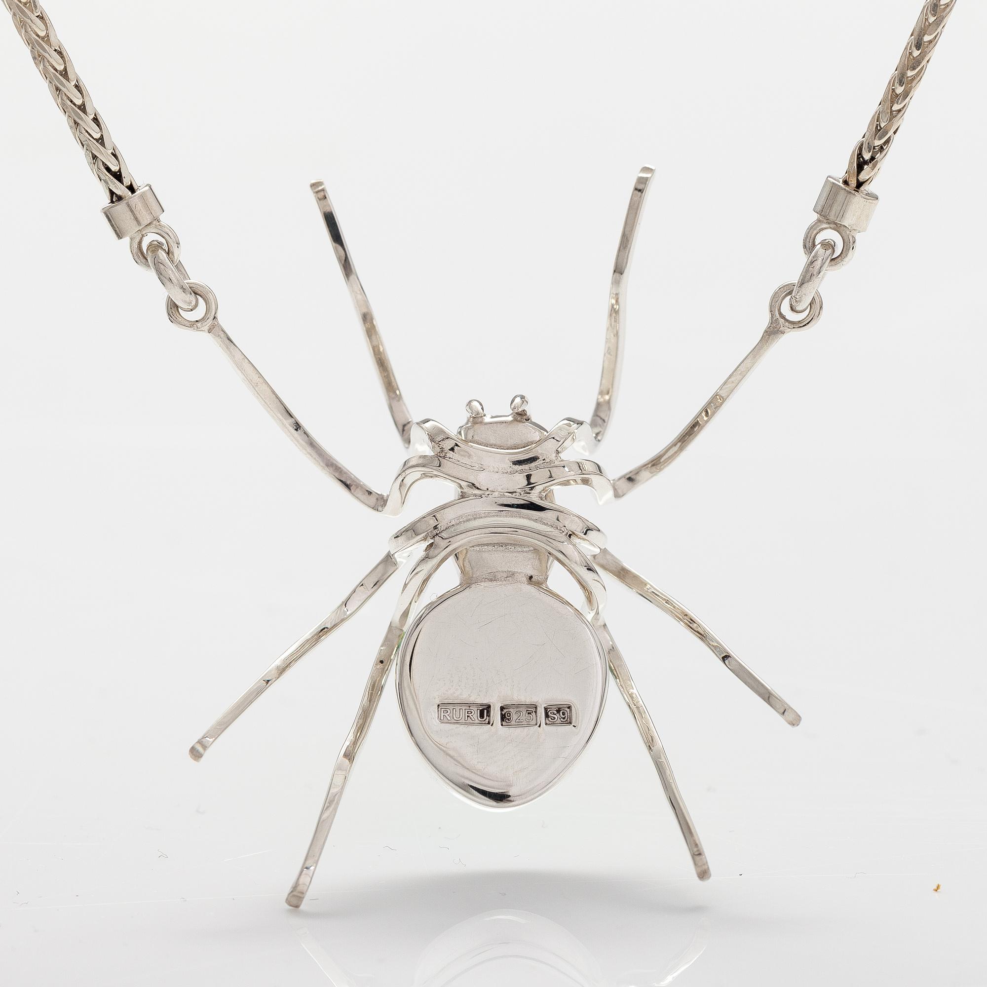 A sterling silver necklace "Spider" with dichroich glass. Ru Runeberg 2019.