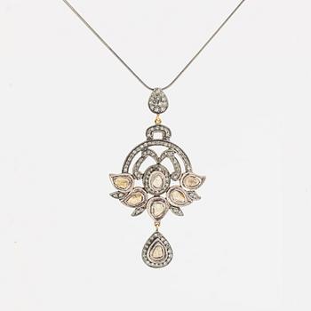 A faceted diamond necklace.