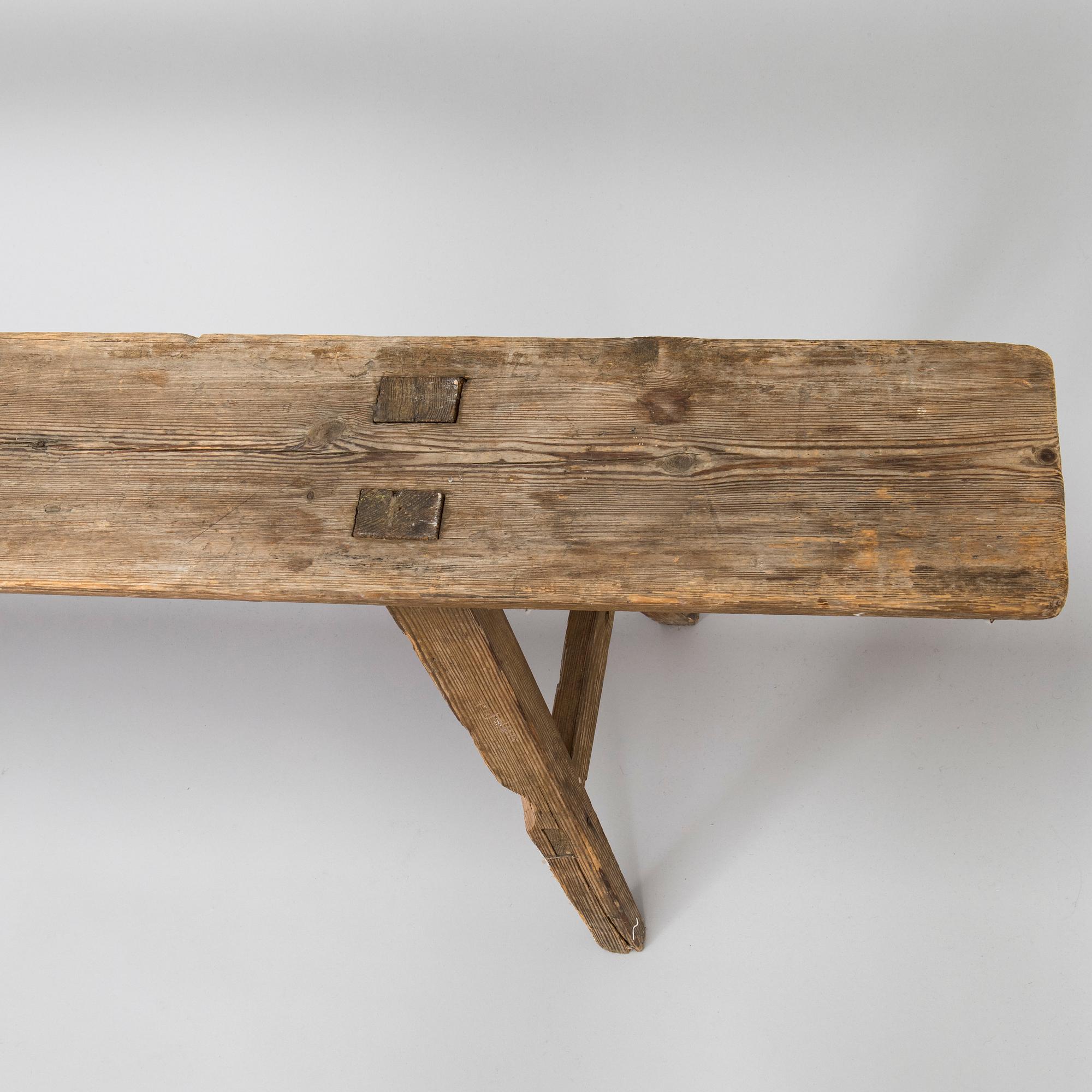 A folk art bench, circa 1900.