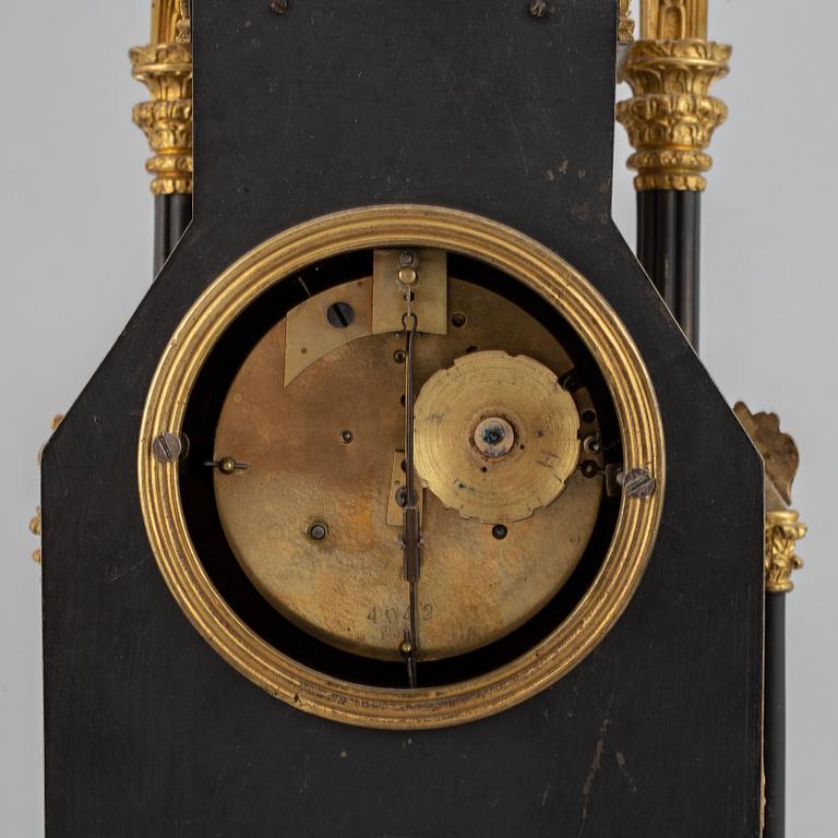 A gothic revival mantel clock.