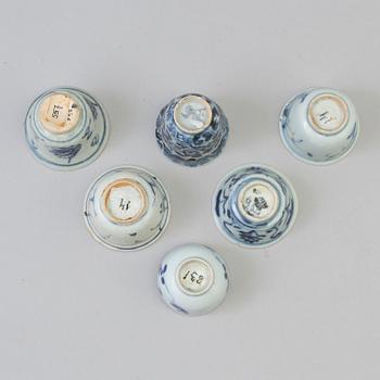 A set of six odd blue and white cups, Ming dynasty (1368-1644).