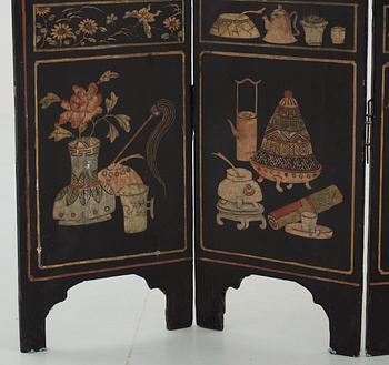 An eight panel lacquer screen, Qing dynasty, presumably Kangxi (1662-1722).