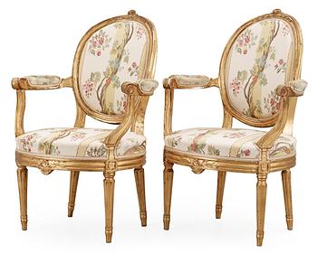 592. A pair of Gustavian late 18th Century armchairs.