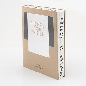 Moncler, book 'Freeze for Frieze' and thermos.