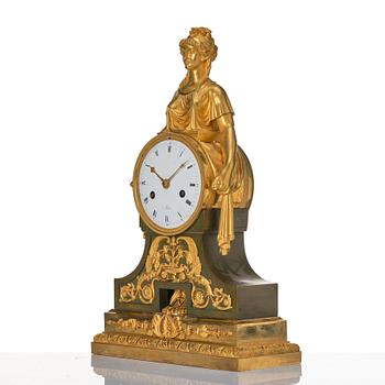 An Empire bronze mantle clock.