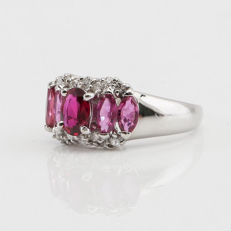 Ring in 850 platinum with navette-cut pink sapphires and round brilliant-cut diamonds.