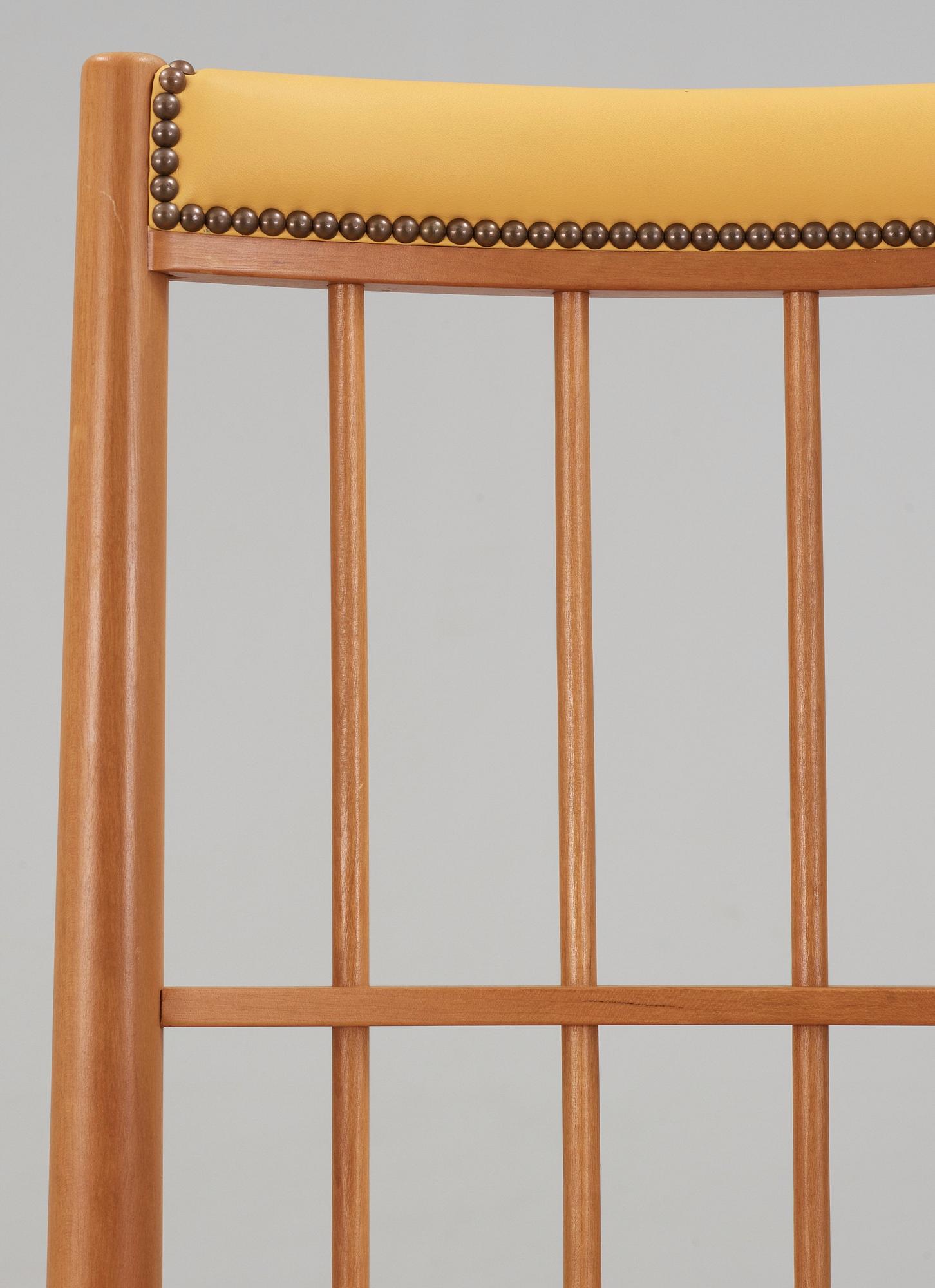 A Josef Frank cherry and yellow leather armchair, Svenskt Tenn, model 652.