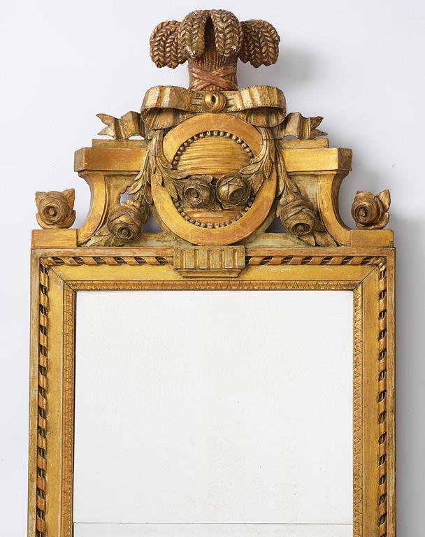 A Gustavian giltwood mirror by C. G. Fyrwald (master in Stockholm 1776-1825).