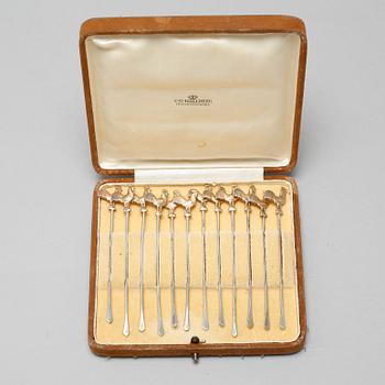 Twelve cocktail sticks in silver, made by Ge-Kå-Smyckek G Kaplan in Stockholm 1949. Weight 45 g.