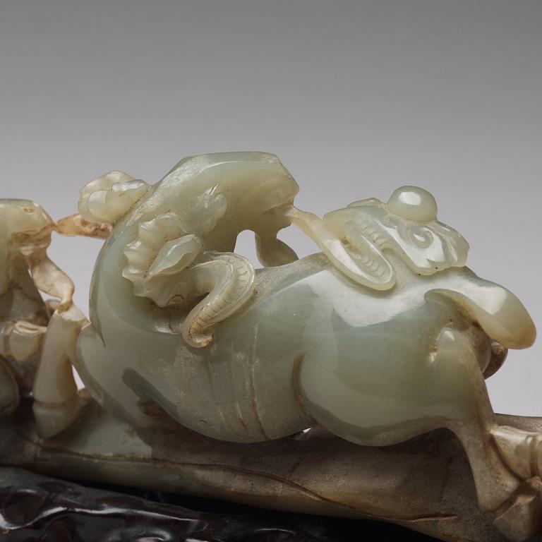 A Chinese nephrite sculpture of three rams.