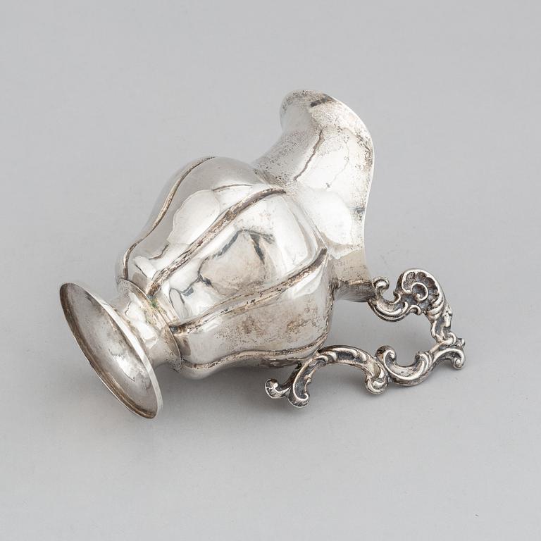 A Swedish 19th century parcel-gilt silver cream-jug, mark of Oskar Ahlström, Södertälje 1856.