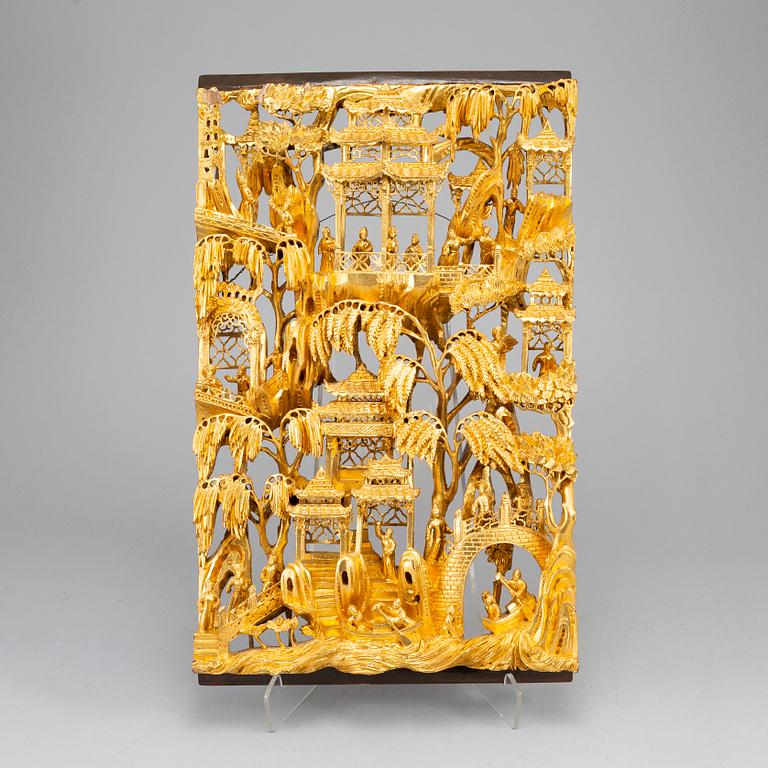 A Chinese wooden and lacquered wood panelm early 20th century.