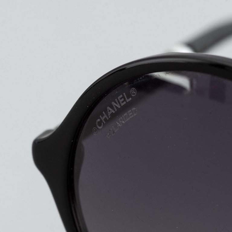 Chanel, a pair of sunglasses.