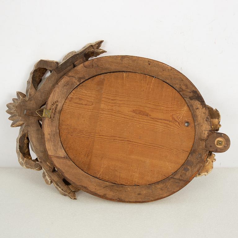 A pair of one-light Gustavian-style giltwood girandole mirrors, late 18th c /resp circa 1900.