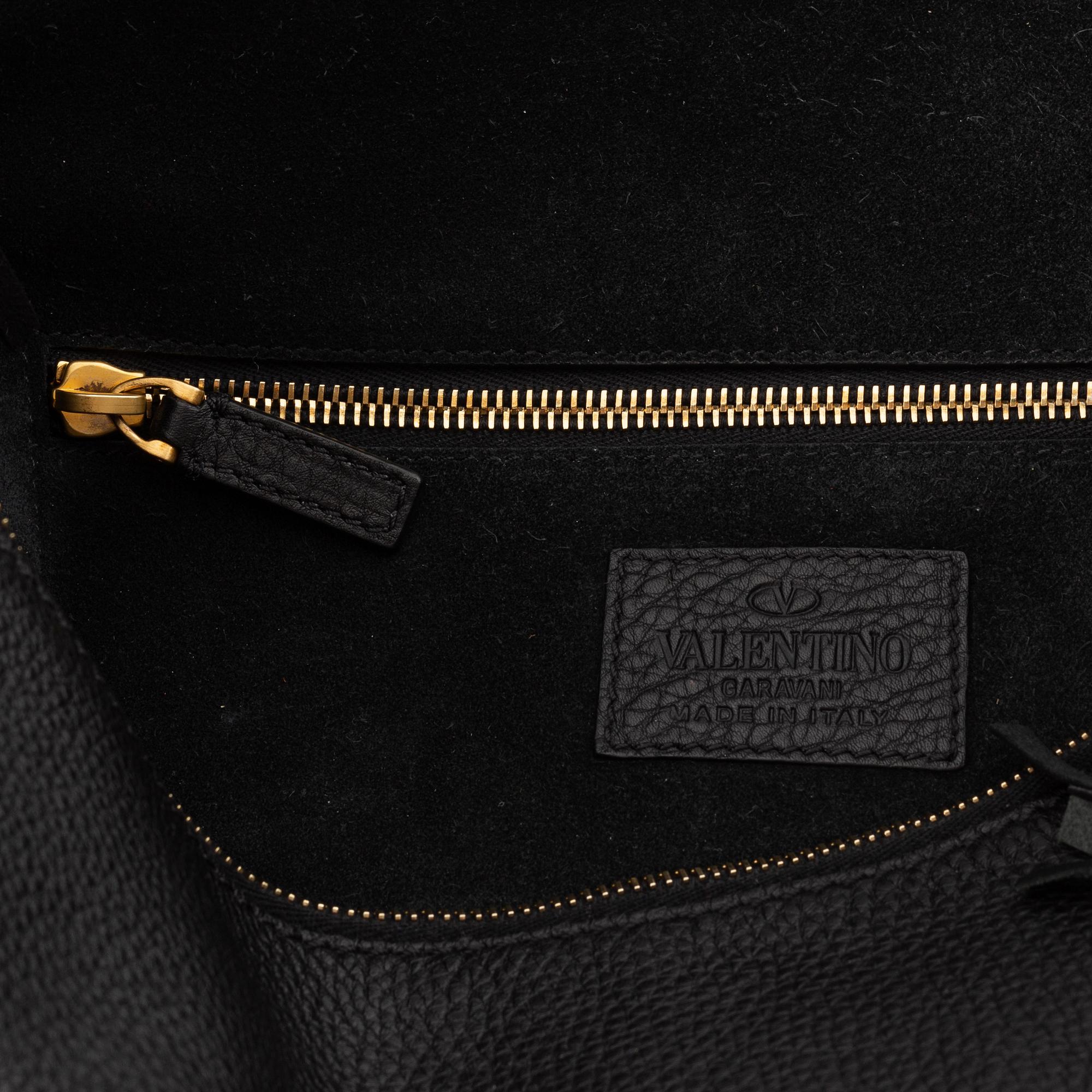 Valentino, a black leather hobo bag.