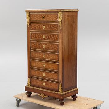 A Louis XVI-style chest of drawers, circa 1900.