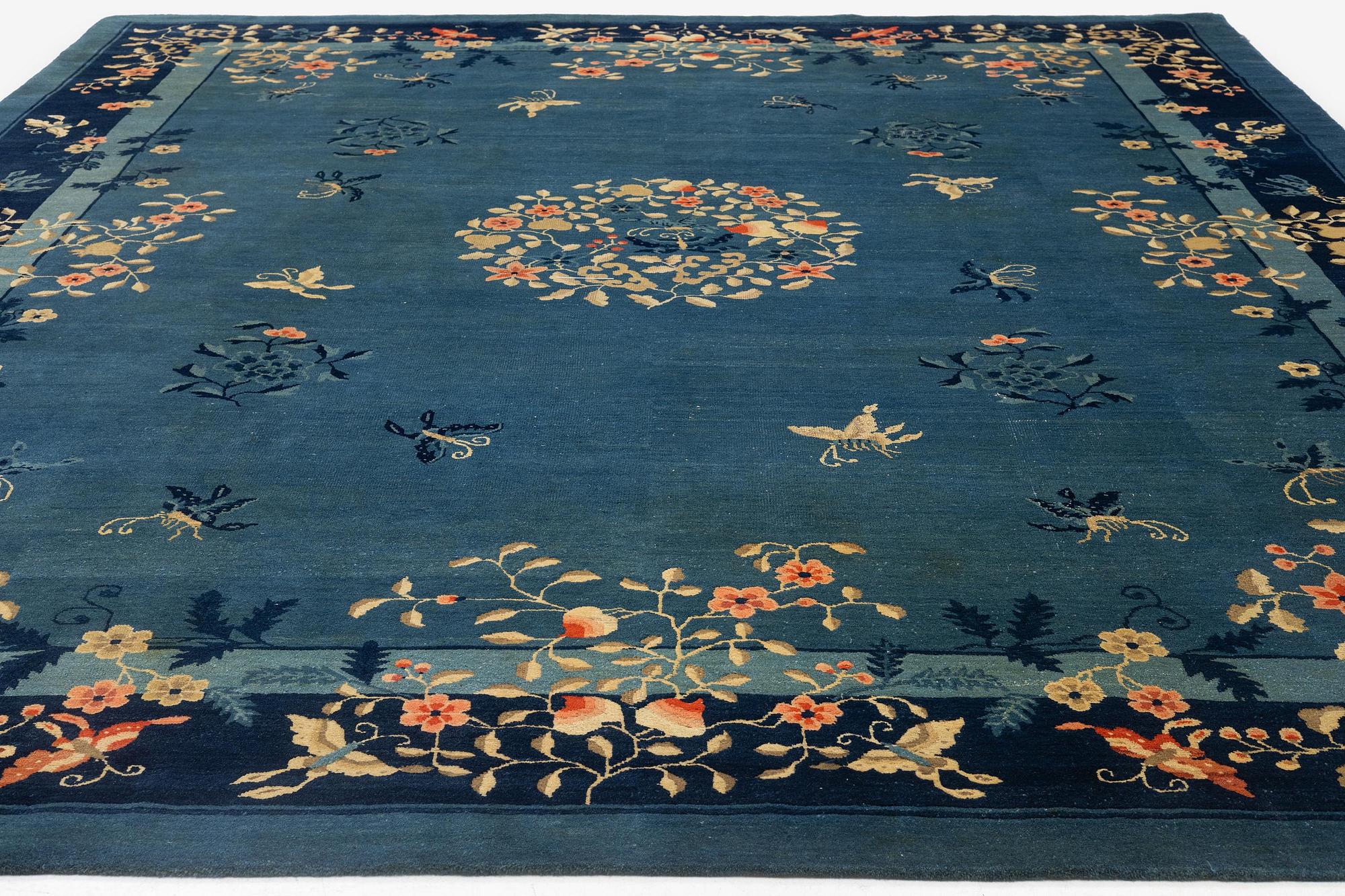 An antique Beijing carpet, northern China, c. 365 x 294 cm.