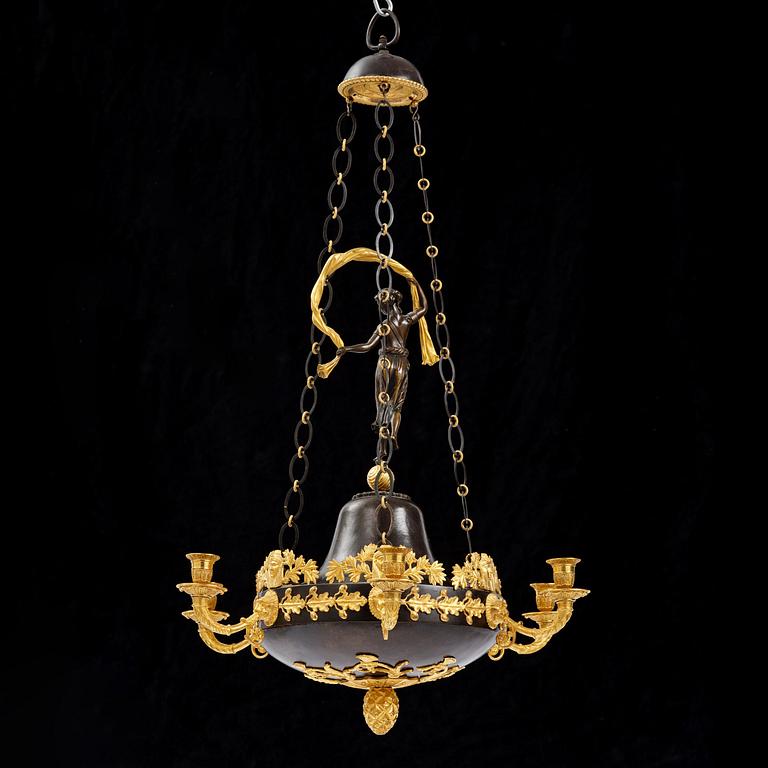 A patinated and ormolu six-light Empire chandelier, Stockholm, first part 19th century.