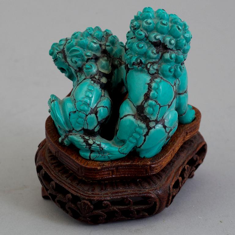 A Chinese carved turquoise sculpture, 20th century.