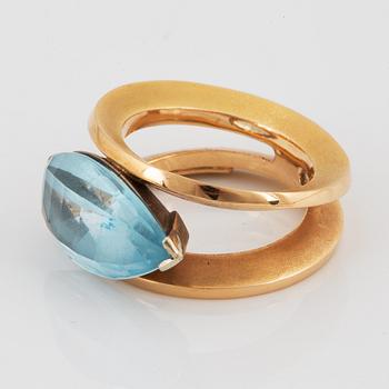 18K gold and navette shaped blue topaz.