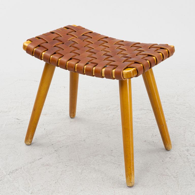 A mid 20th century birch stool with leather.