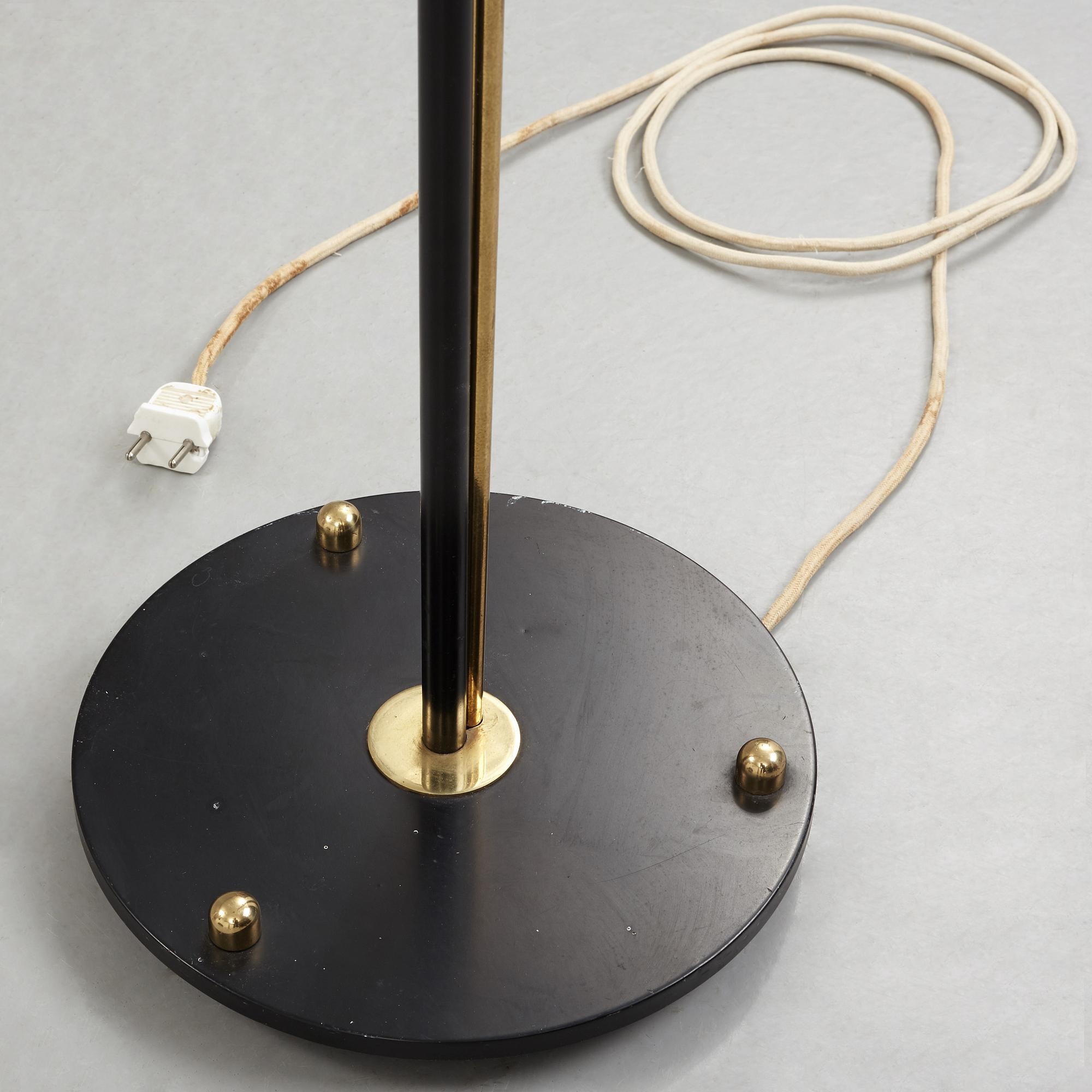 A Swedish Modern brass and black lacquered floor lamp, 1950's.