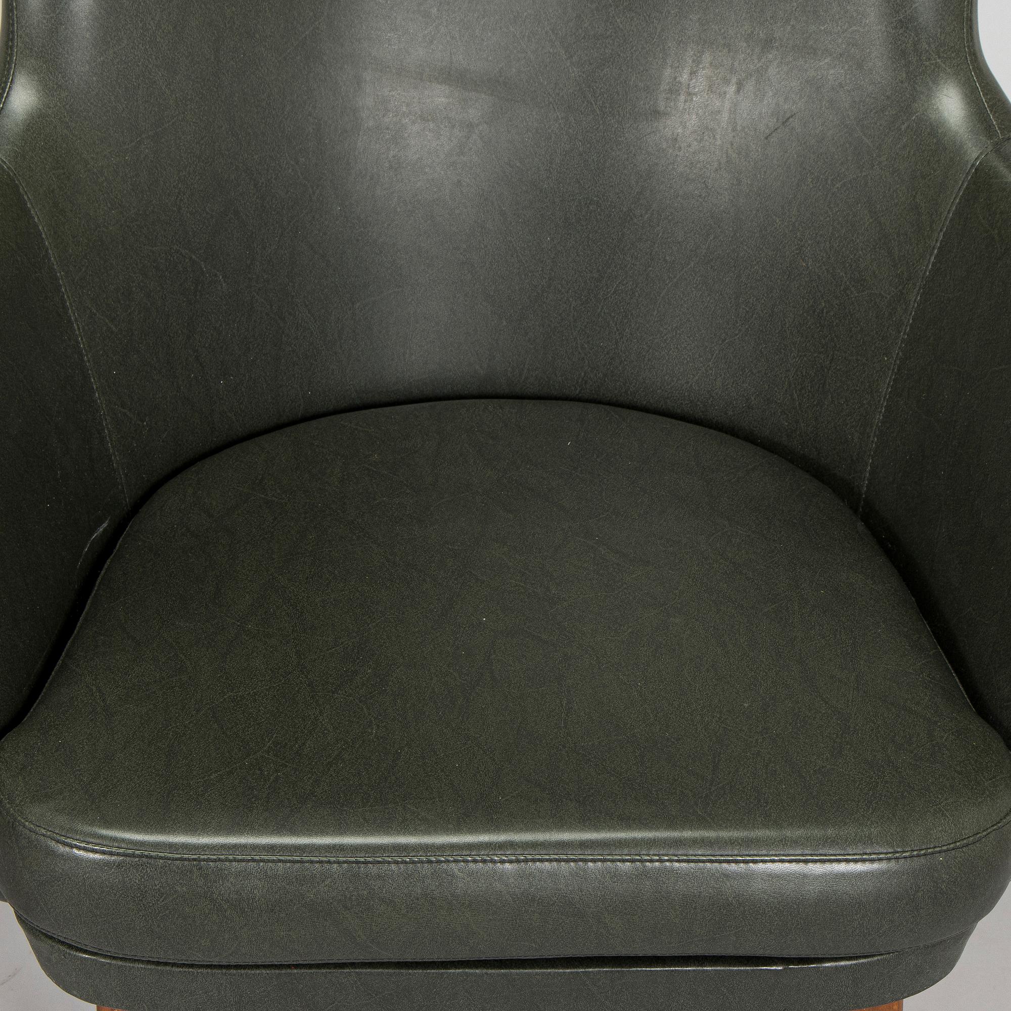 A pair of mid-20th century armchairs.