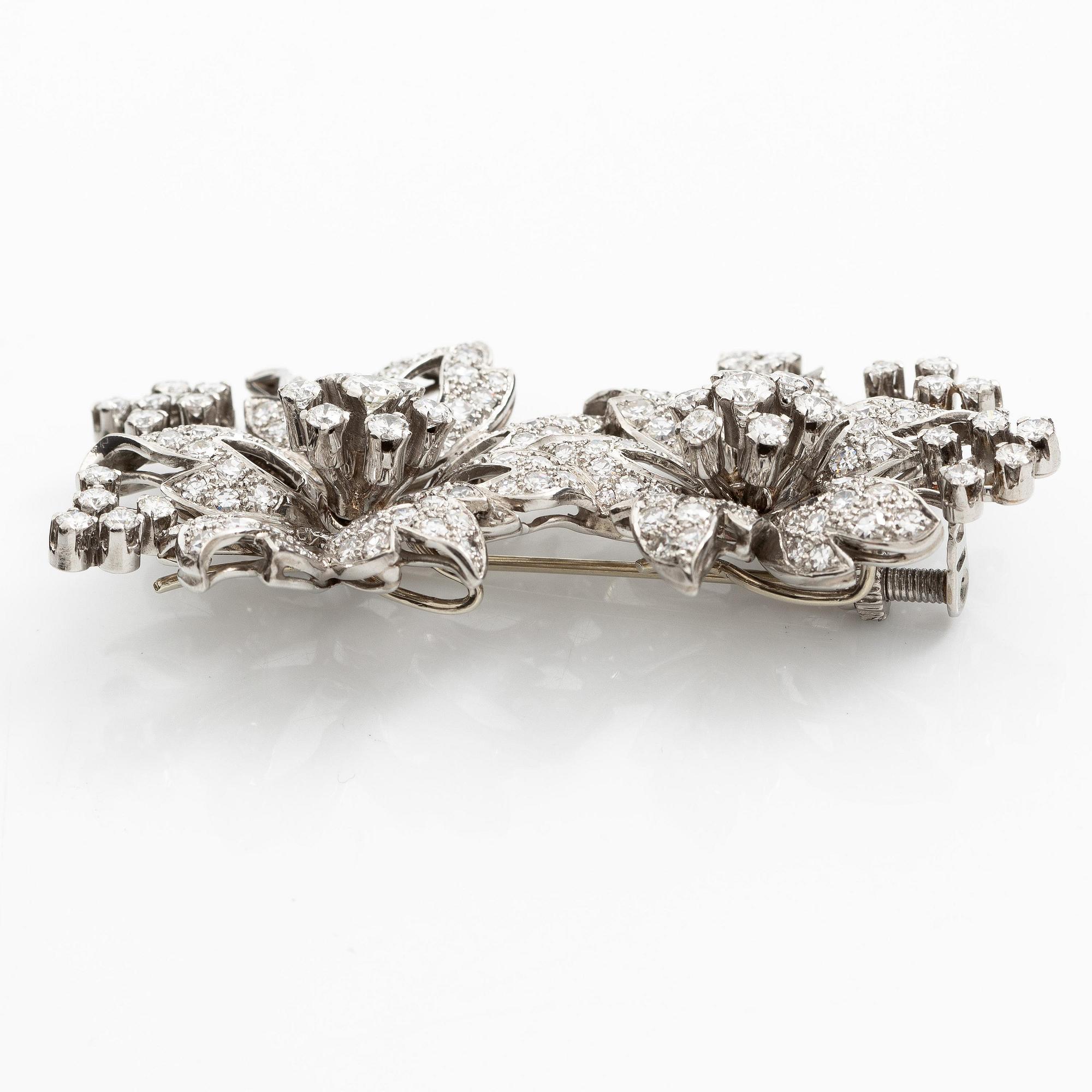 Brosch platina med runda briljant- och åttkantslipade diamanter.