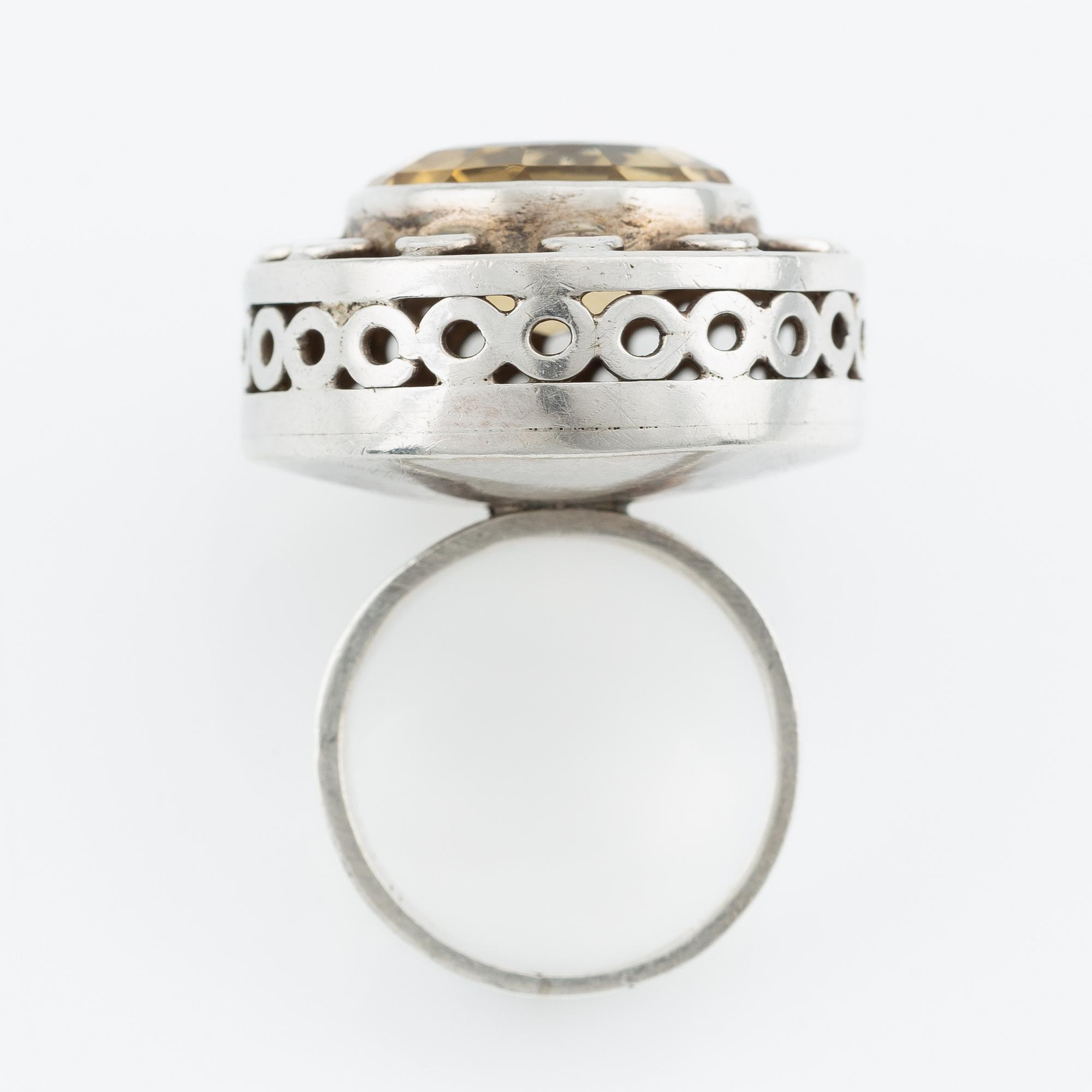 Silver ring with gold stone, signed Ulla Holm.