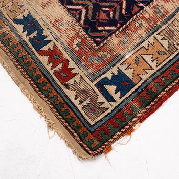 A antique Kazak gallery carpet, ca 310 x 105 cm.