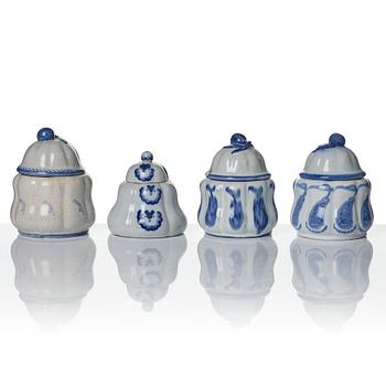 Wilhelm Kåge, eleven pieces of faience including jars, inkwells and a tulip vase, Gustavsberg, Sweden, 1919-1920.