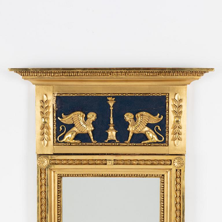An Empire mirror, first half of the 19th Century.