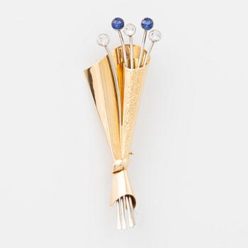 18K gold, white and blue sapphire brooch.
