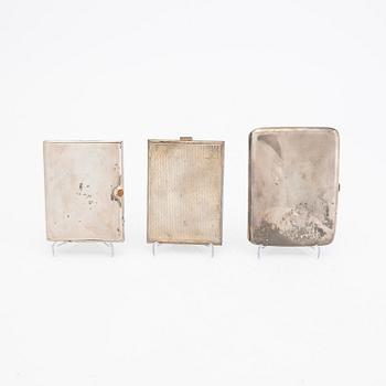 A set of three different 20th century silver cigarette cases, weight in total 456 grams.