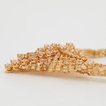 18K gold necklace with brilliant-cut diamonds and trapets-cut diamonds.