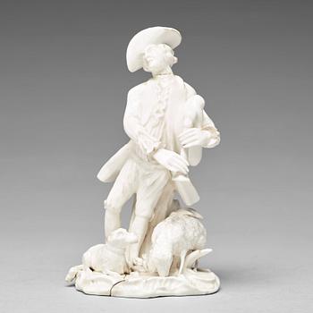 311. A Swedish Marieberg soft paste figure of a bag-piper, 18th Century.