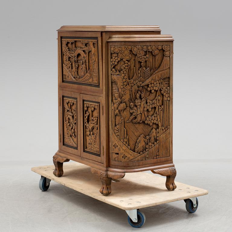 a chinese style bar cabinet from the late 20th century.