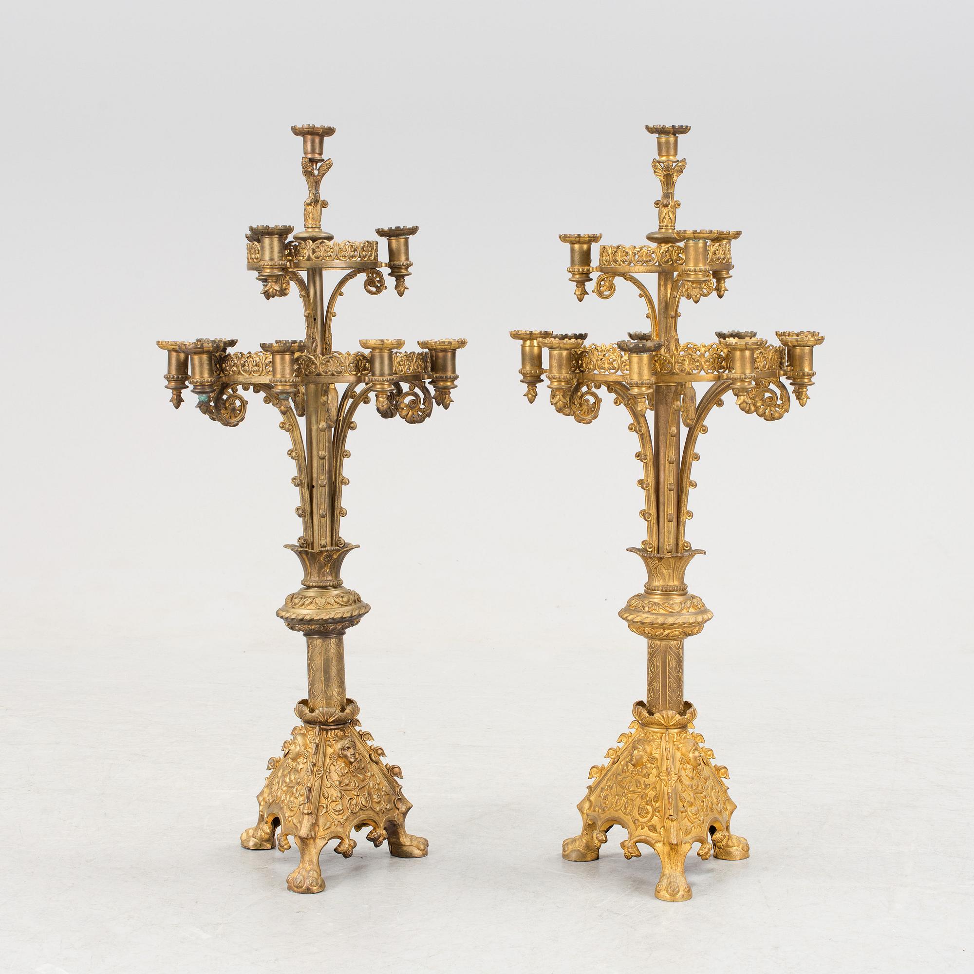 Two similar 19th century bronze candelabras.